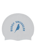 A white silicone swim cap featuring a blue printed logo with the text 'BUDGY SMUGGLER' and a bird illustration, shown against a plain white background.